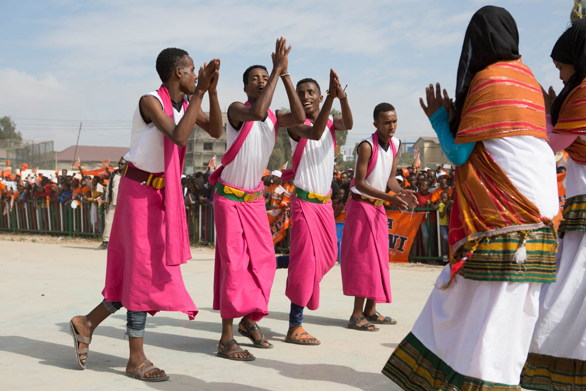 Traditional Somali dancers perform at a Waddani rally in Freedom Park, Hargeisa. Religious leaders expressed concern to the National Electoral Commission (NEC) about what they consider to be ‘un-Islamic behaviour’ during the campaigns, with the playing of music and men and women dancing together. The NEC however, let the rallies go ahead, arguing that the right to campaign is written into the constitution. [Kate Stanworth/Saferworld/Al Jazeera]