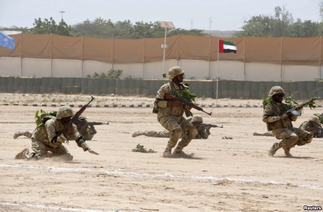 FILE - Members of the Somali military perform a defensive drill after attending a commando training exercise in Mogadishu, Jan. 20, 2016.